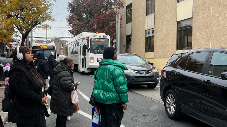Riders waiting for trolley stuck in traffic
